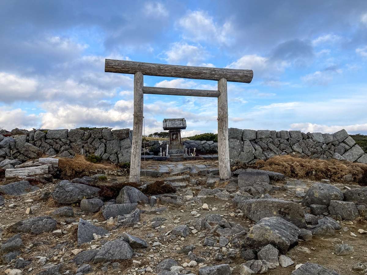The torii gate and temple atop Mt. Goyozan